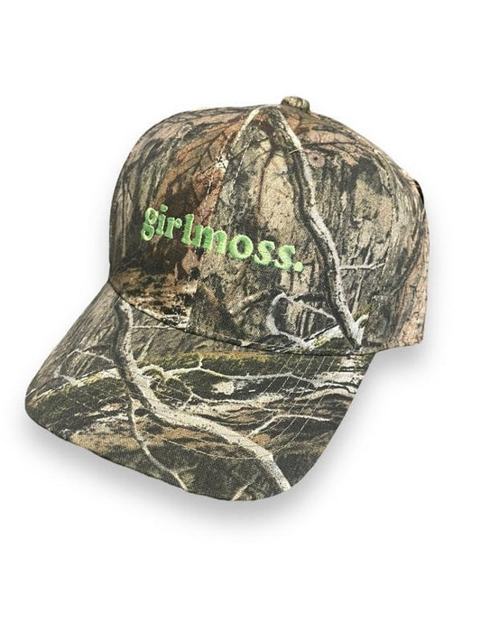 Girlmoss unstructured on camo dad hat with lime green thread.