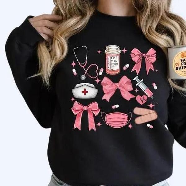 Work Cute Nurse Crewneck, Nurse Coquette Bow Sweater, NICU Sweaters, New Nurse Gift, Soft Girl Nurse Graduation... (Image 1)